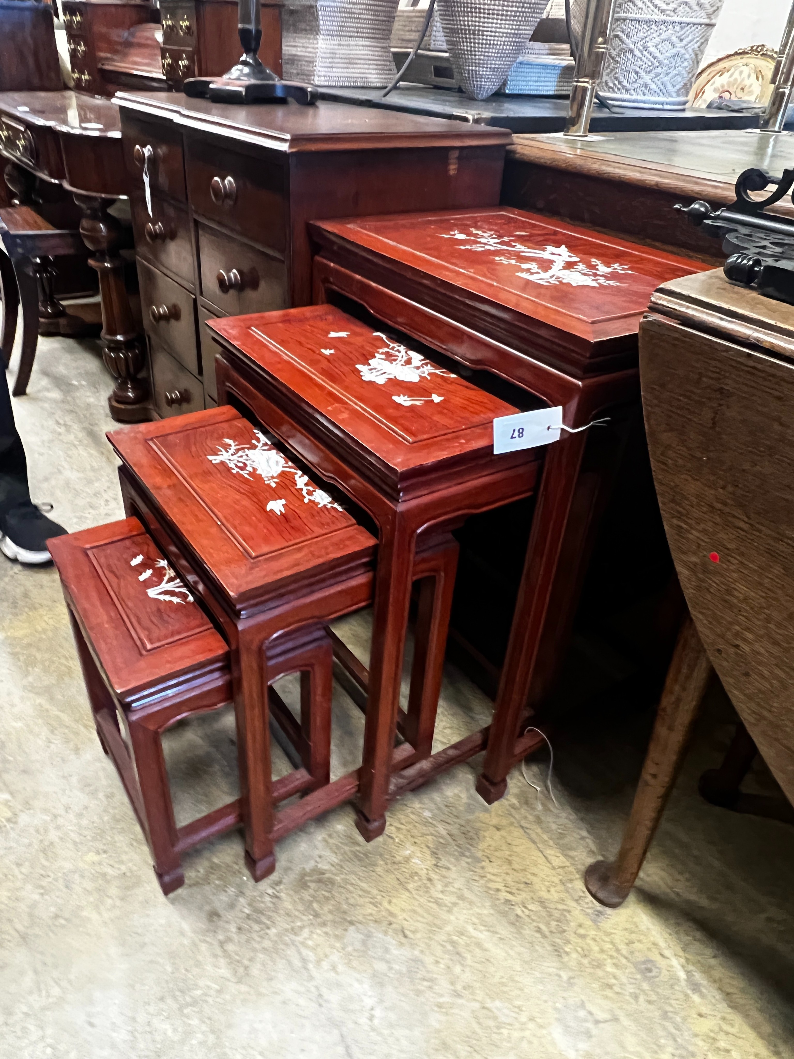 A quartetto of Chinese mother-of-pearl inlaid rectangular hardwood tea tables, width 50cm, depth 36cm, height 67cm